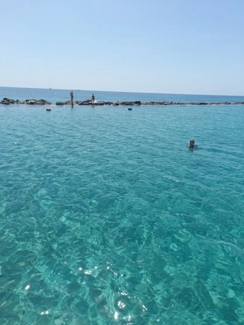 Swimmers enjoying the crystal-clear waters near Paphos, viewed from the Yellow Glass Bottom Boat.