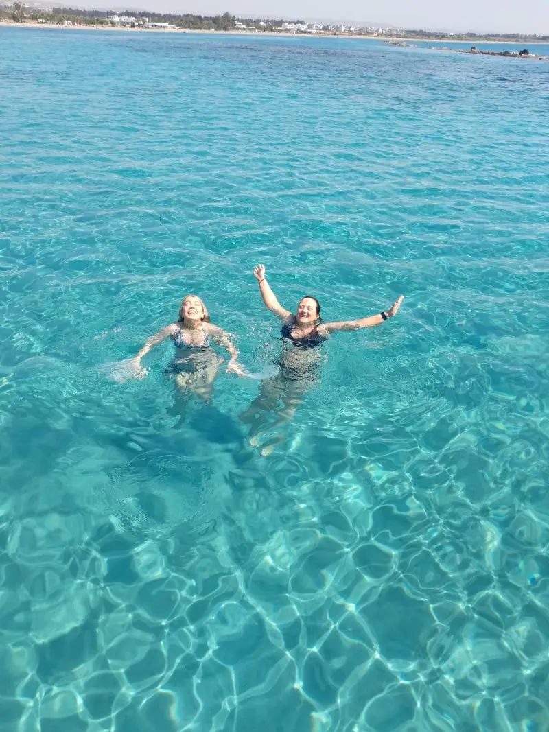 Customers enjoying the crystal-clear waters of Paphos, Cyprus, after a trip on the Yellow Glass Bottom Boat.